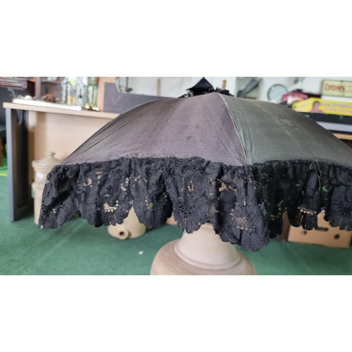 487 - 2x victorian parasols inc a black silk and lace parasol. The black parasol has a briar wood handle, ... 