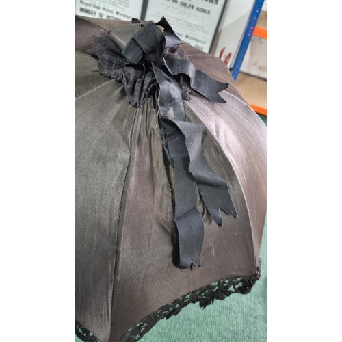 487 - 2x victorian parasols inc a black silk and lace parasol. The black parasol has a briar wood handle, ... 