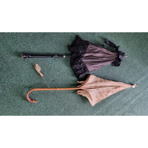 487 - 2x victorian parasols inc a black silk and lace parasol. The black parasol has a briar wood handle, ... 