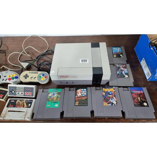 490 - Nintendo entertainment system console with 7 games 4x controllers a scorpion laser gun complete with... 