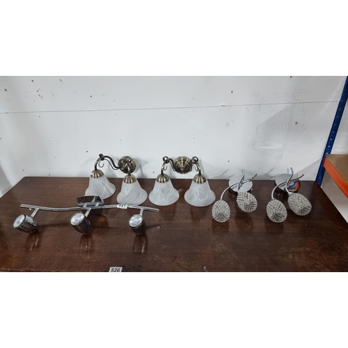 531 - Collection of 2 pairs of modern wall light fittings along with a three spot light ceiling fitting