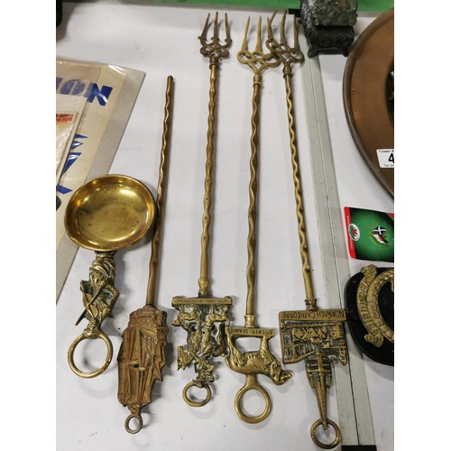 48 - Suite of metal ware inc brass and copper with toasting forks brass bell grease gun trivets an art no... 