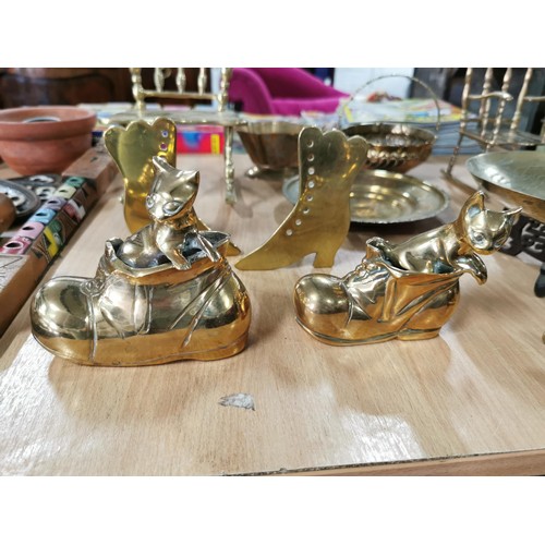 58b - Large quantity of brass ware inc 2x brass model rocking chairs 2x brass cats in boots a middle easte... 