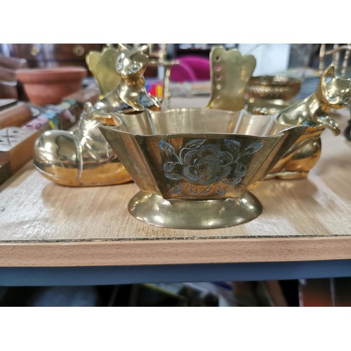 58b - Large quantity of brass ware inc 2x brass model rocking chairs 2x brass cats in boots a middle easte... 