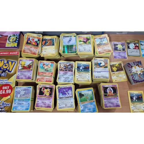 34 - A large comprehensive collection of Pokemon items inc a very large collection of Pokemon cards of va... 