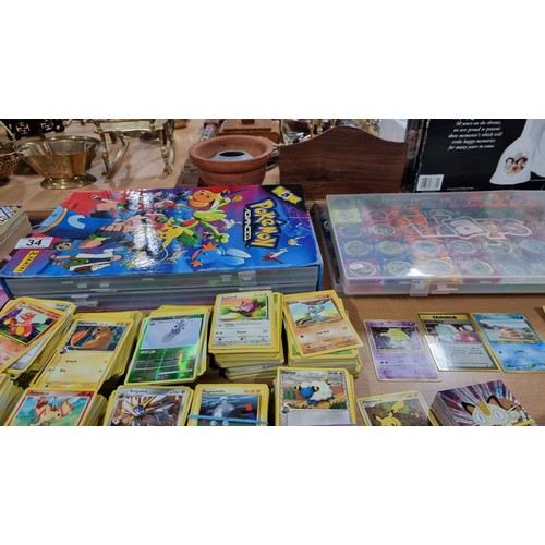 34 - A large comprehensive collection of Pokemon items inc a very large collection of Pokemon cards of va... 