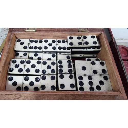 8 - A quantity of of various games inc well carved wooden box containing a set of antique bone dominoes ... 