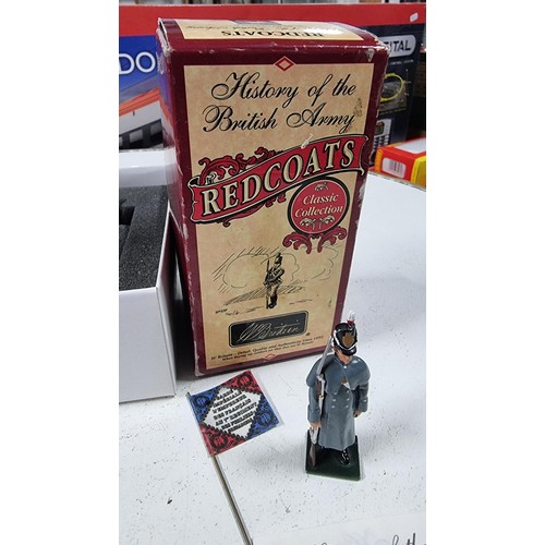 25 - Boxed military boxed  figure by britain Red coats classic collection along with a tall resin figure ... 