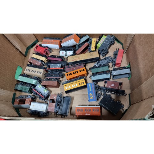 34 - Large quantity of OO gauge rolling stock inc to locomotives a black loco 47458 and a blue diesel loc... 