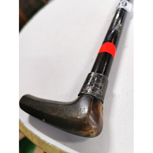 60 - Antique solid ebony walking stick with a horn handle and a hallmarked silver collar.

Table is for d... 