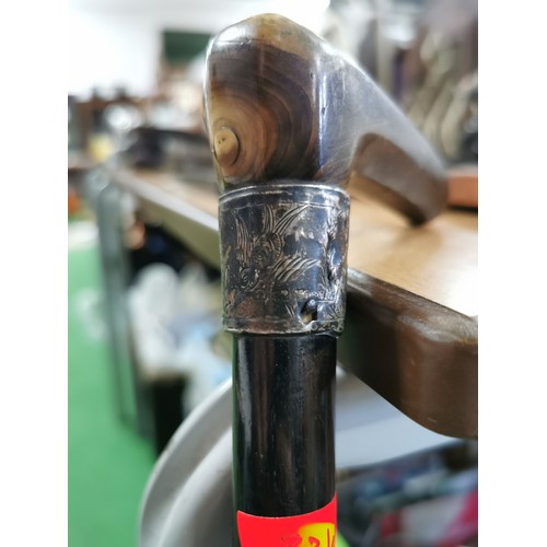 60 - Antique solid ebony walking stick with a horn handle and a hallmarked silver collar.

Table is for d... 