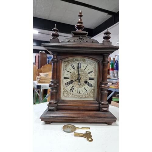 68 - Antique black forest 14 day strike german mantel clock by H.A.C. with three carved spindles in good ... 