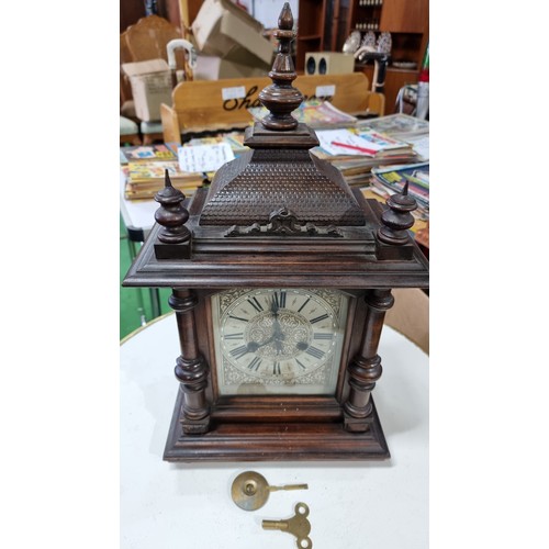 68 - Antique black forest 14 day strike german mantel clock by H.A.C. with three carved spindles in good ... 