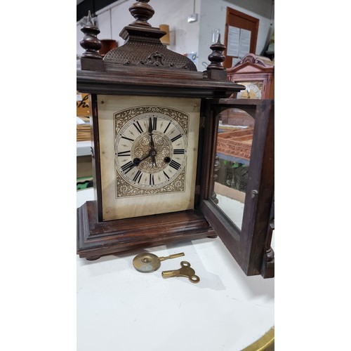 68 - Antique black forest 14 day strike german mantel clock by H.A.C. with three carved spindles in good ... 