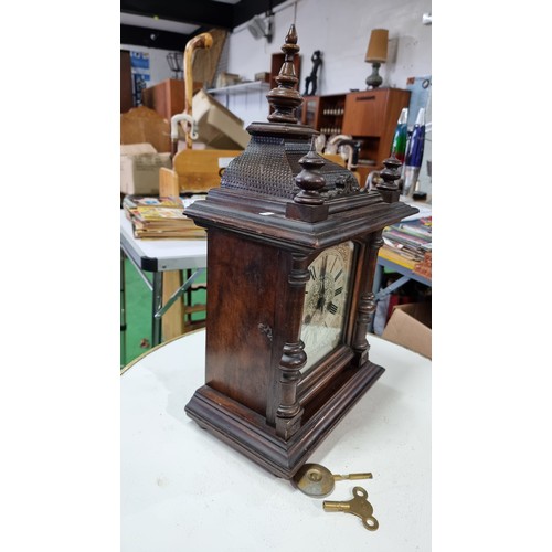 68 - Antique black forest 14 day strike german mantel clock by H.A.C. with three carved spindles in good ... 