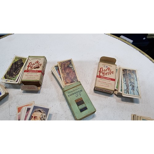 87 - Large quantity of various cigarette boxes all containing complete sets of cigarettes cards along wit... 