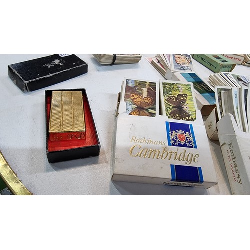 87 - Large quantity of various cigarette boxes all containing complete sets of cigarettes cards along wit... 