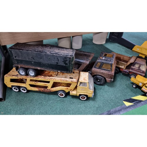 107 - Quantity of large metal Tonka trucks inc a dumper truck in good condition largest truck has a height... 