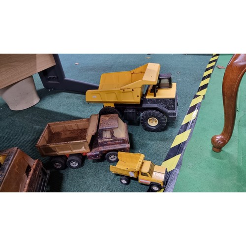 107 - Quantity of large metal Tonka trucks inc a dumper truck in good condition largest truck has a height... 