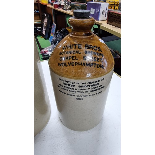 109 - Youngs Botanic flagon along with a White Bros stoneware flagon both in excellent condition tallest m... 