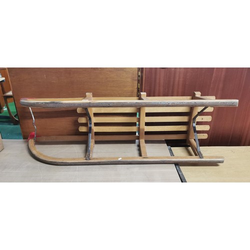 158 - Vintage wooden sleigh in good overall condition. Measures 110cm length x 24cm height x 34cm width.