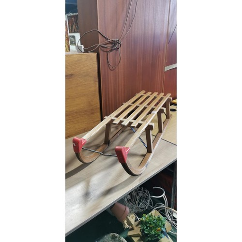 158 - Vintage wooden sleigh in good overall condition. Measures 110cm length x 24cm height x 34cm width.