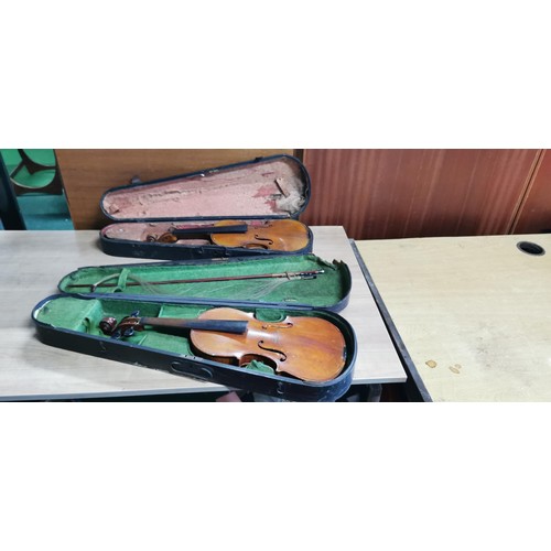 176 - 2x antique violins in need of restoration comes with 2x violin cases. 1x appears to be an early Gibs... 