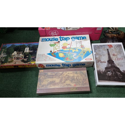 111 - A box full of new and sealed puzzles 8x in total inc a 3000 piece puzzle along with a box of various... 