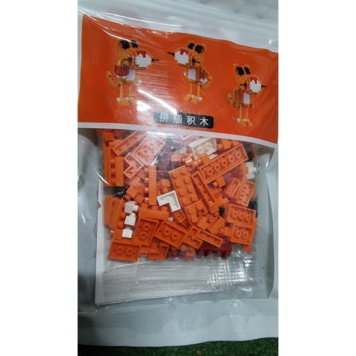 113 - Large job lot of new and sealed Lego type sets which make up figures in 2 boxes