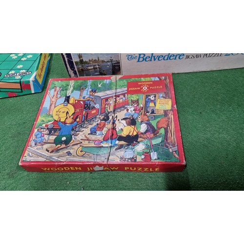 114 - Quantity of 12 various jigsaw puzzles inc a large 3000 piece puzzle along with a children's vintage ... 