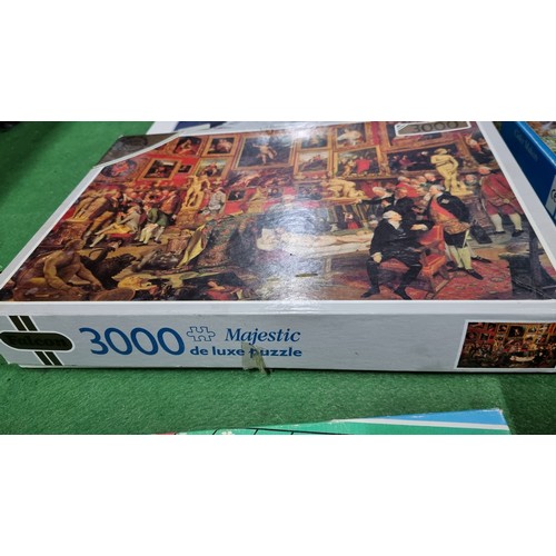 114 - Quantity of 12 various jigsaw puzzles inc a large 3000 piece puzzle along with a children's vintage ... 