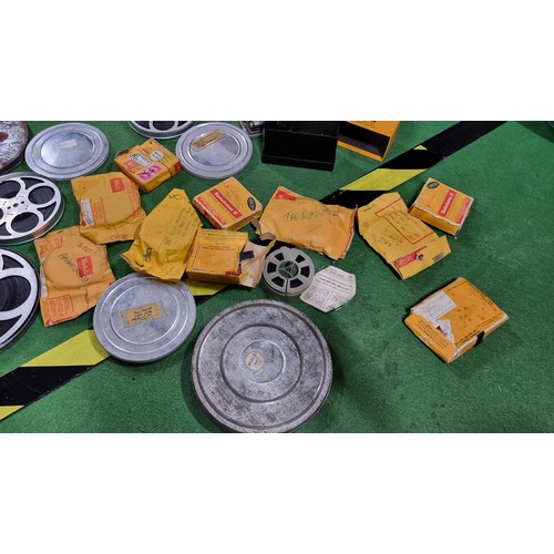 116 - Large job lot of vintage 8mm film reels in metal tins and plastic cases of various types and subject... 