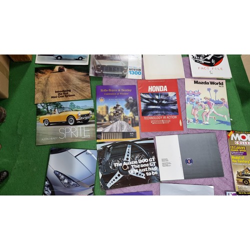 124 - Very large collection of automobilia ephemera to inc a large quantity of vintage car manuals and sal... 