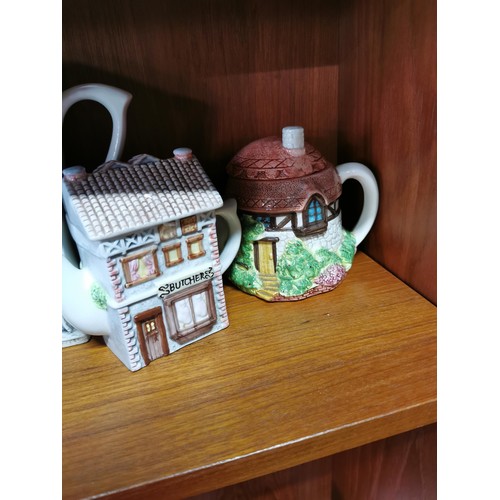 231 - Large qty of various collectable ceramic cottage teapots some are by Leonardo