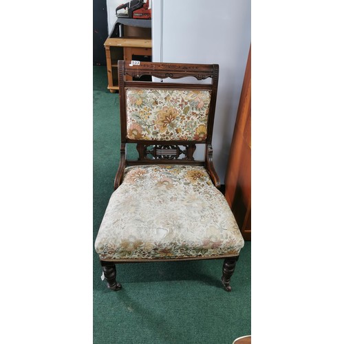 533 - Fine Edwardian nursing chair on wheels in need of re-upholstering