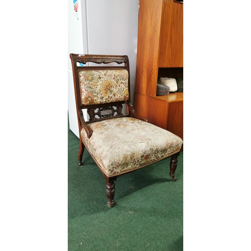 533 - Fine Edwardian nursing chair on wheels in need of re-upholstering