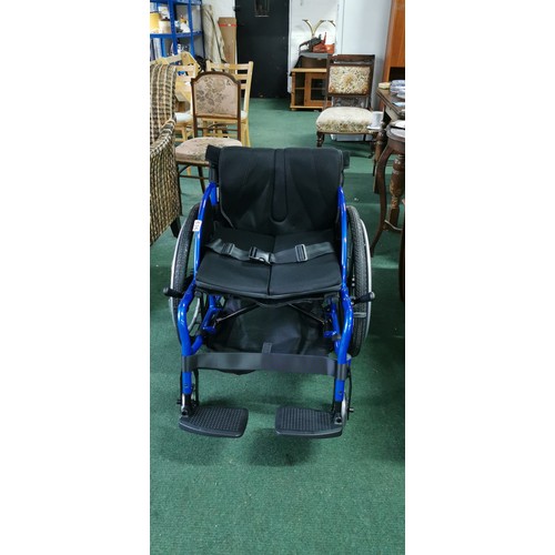 536 - Foldable wheelchair in near mint condition never used when bought by vendor and stored. A none push ... 