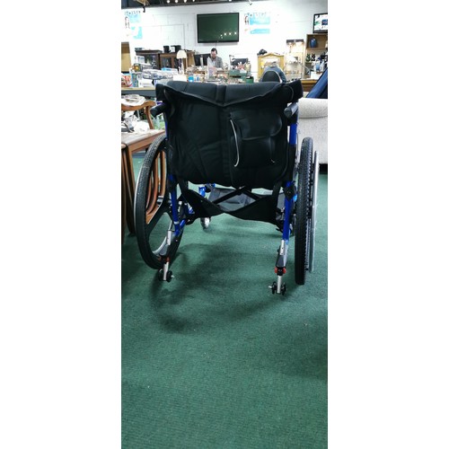 536 - Foldable wheelchair in near mint condition never used when bought by vendor and stored. A none push ... 