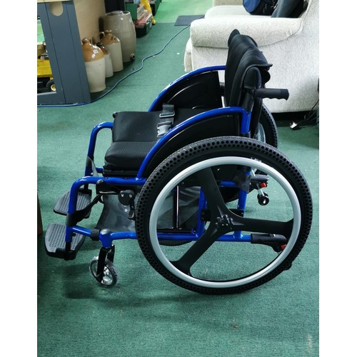 536 - Foldable wheelchair in near mint condition never used when bought by vendor and stored. A none push ... 