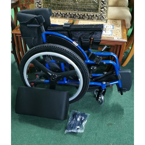 536 - Foldable wheelchair in near mint condition never used when bought by vendor and stored. A none push ... 