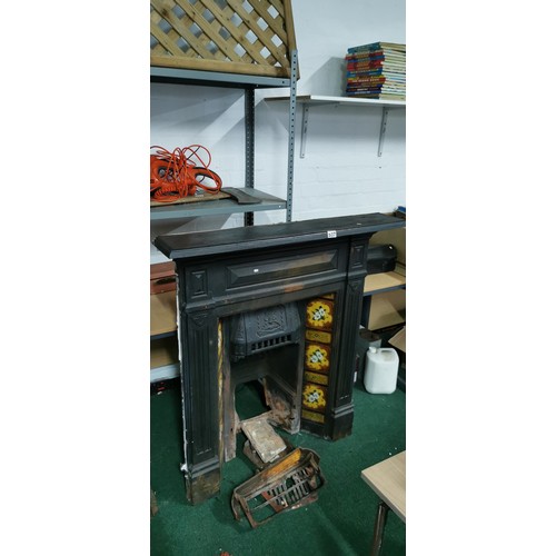 537 - Victorian cast iron fireplace with interesting tiling all in good order.
117cm high
103 wide
19cm de... 