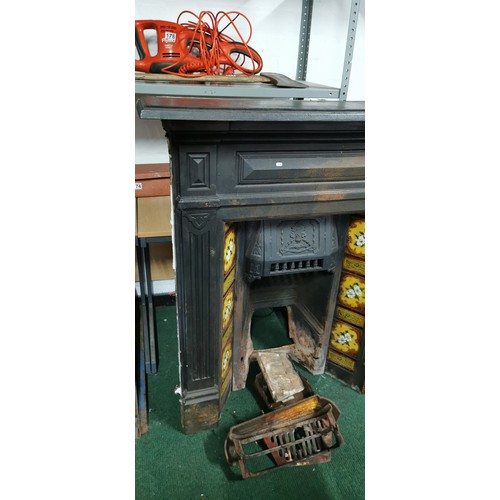 537 - Victorian cast iron fireplace with interesting tiling all in good order.
117cm high
103 wide
19cm de... 