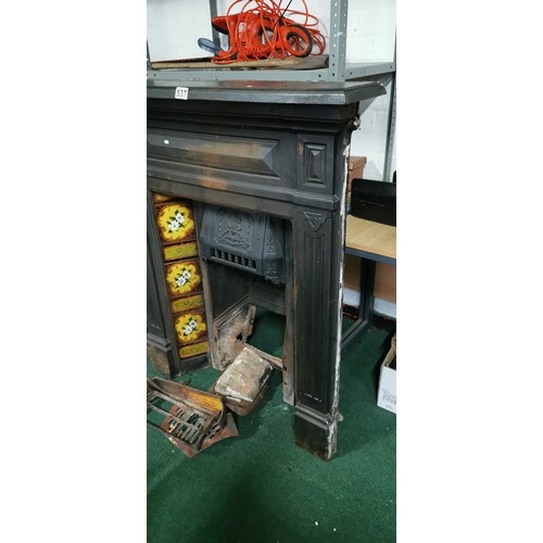 537 - Victorian cast iron fireplace with interesting tiling all in good order.
117cm high
103 wide
19cm de... 