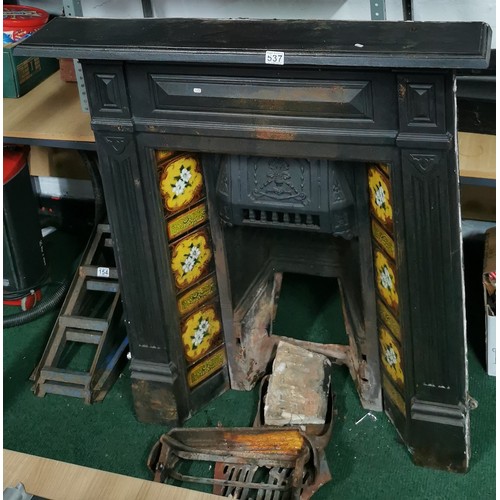 537 - Victorian cast iron fireplace with interesting tiling all in good order.
117cm high
103 wide
19cm de... 