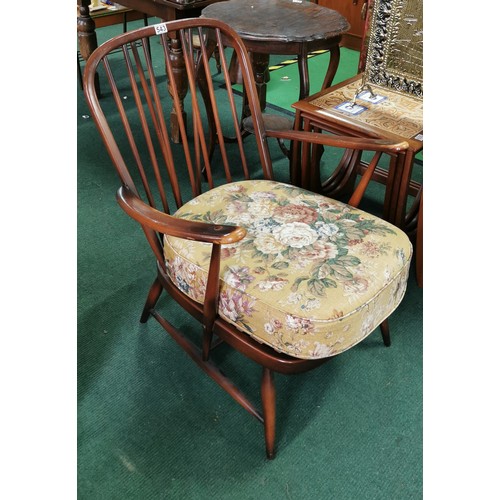 543 - Ercol arm chair spindle back in dark elm.