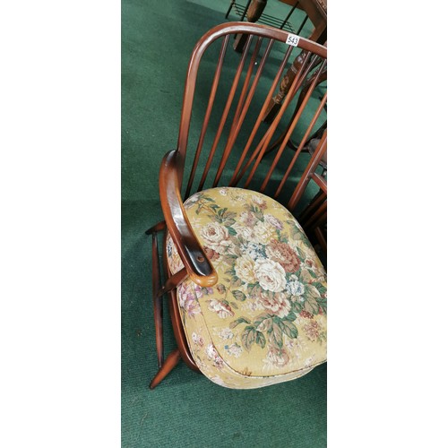 543 - Ercol arm chair spindle back in dark elm.