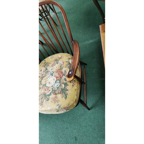 543 - Ercol arm chair spindle back in dark elm.