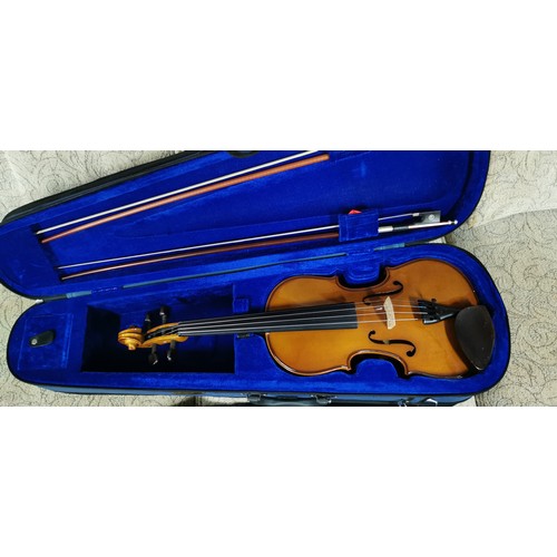 57A - Stentor Student I violin 4/4 used just once in its original carry case. 
Comes with 2 bows & tin of ... 