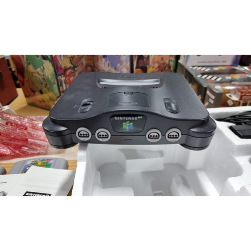 9 - Boxed Nintendo 64 games console complete inc controller along with one other boxed controller and 6x... 