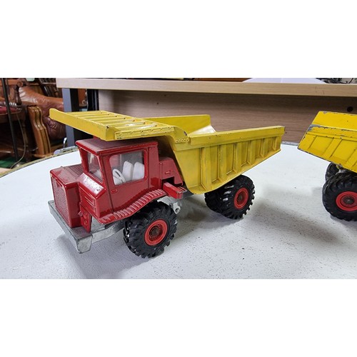 13 - Pair of large Dinky toy centaur diecast dump trucks in good condition height 9cm length 18cm